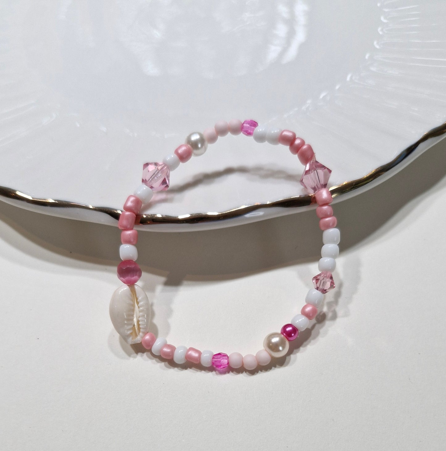 Armbandje kauri roze