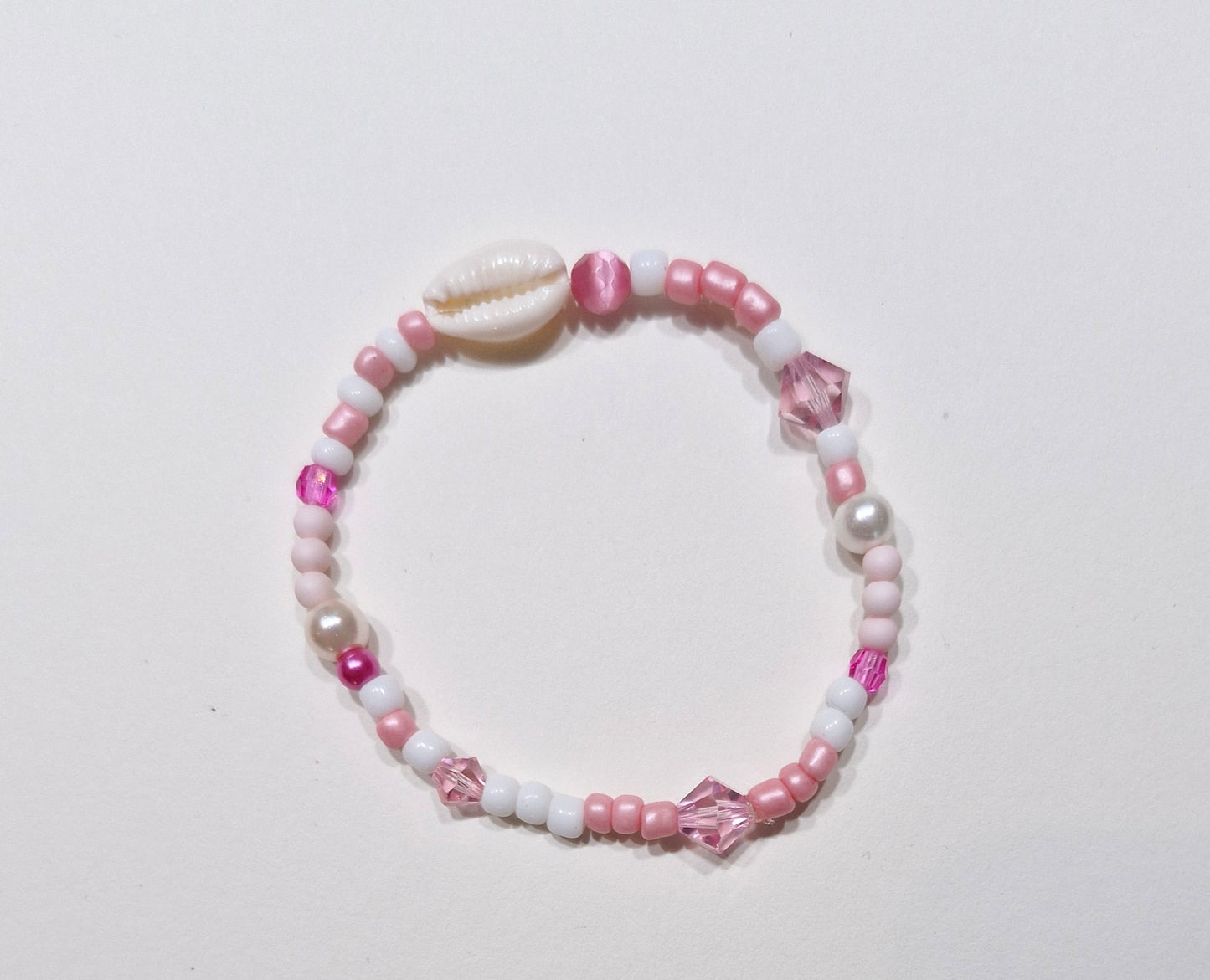 Armbandje kauri roze