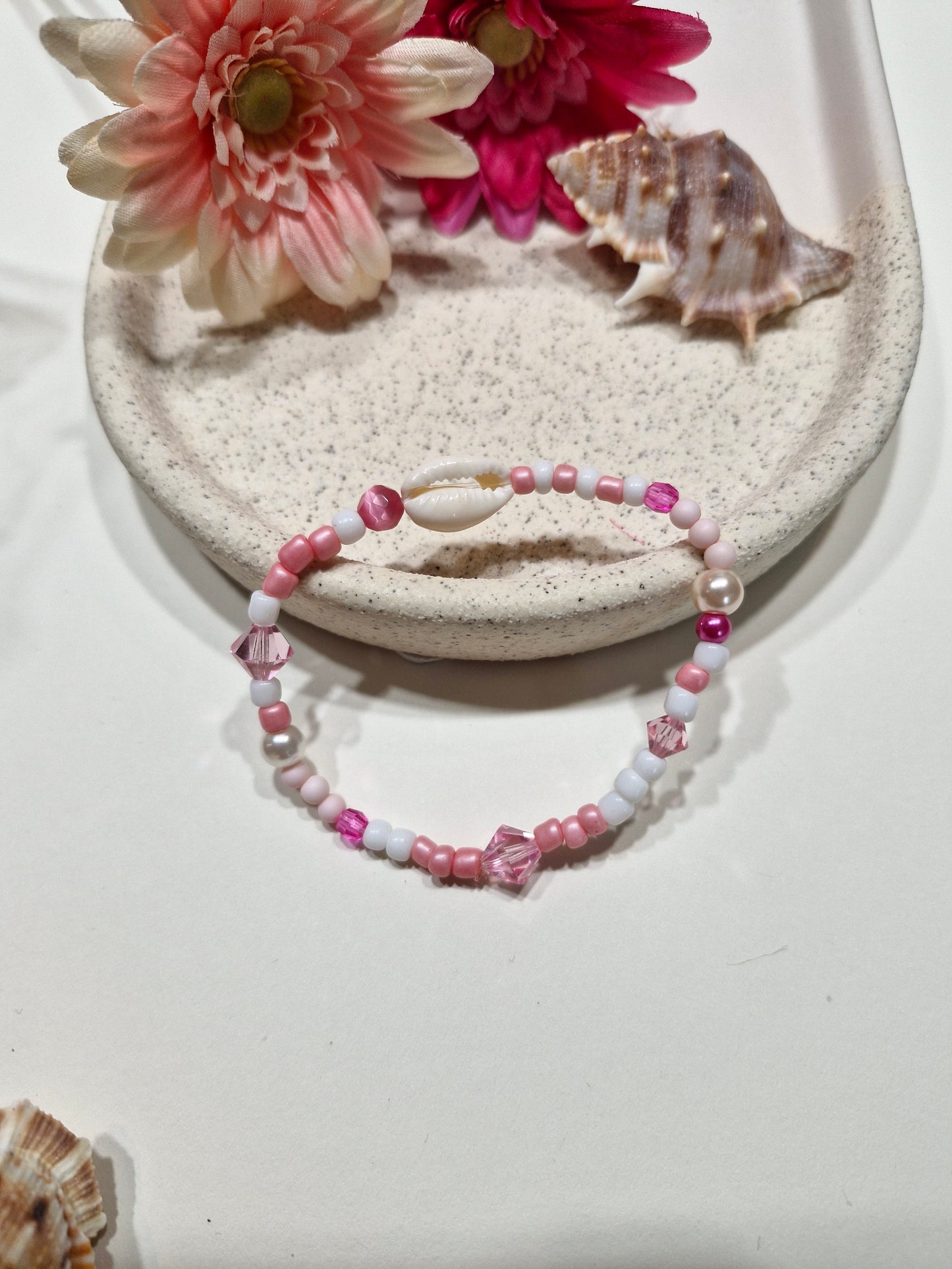 Armbandje kauri roze